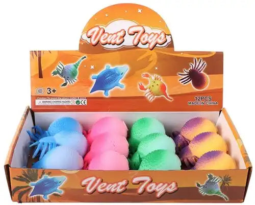 8718546599040 – Squeeze Spin 9cm 62g anti-stress 4 assortis en display (colis 12 pièces)