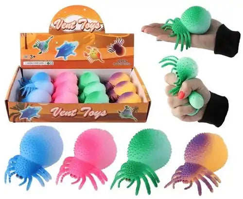 8718546599040 – Squeeze Spin 9cm 62g anti-stress 4 assortis en display (colis 12 pièces)